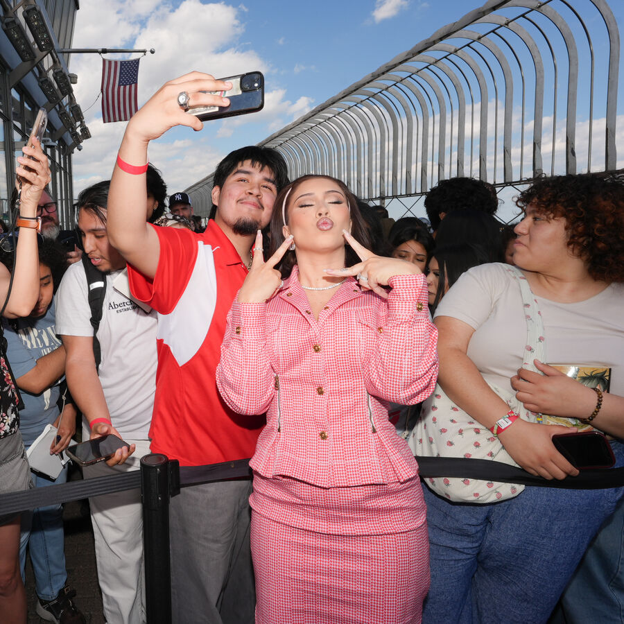 Kali Uchis poses with fans on the 86th Floor Observatory